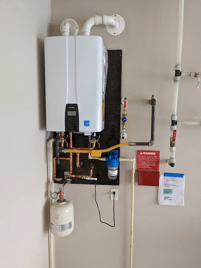 Professional plumber installing copper piping in a Spearfish home